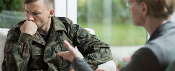Military service member in therapy session with mental health counselor